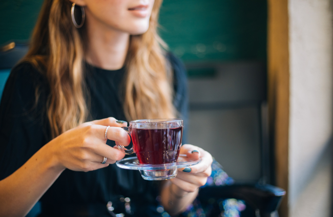 Woman having winter tea at coffee
